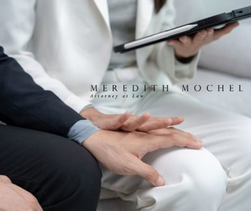 aunwelcomed hand placed on woman's leg