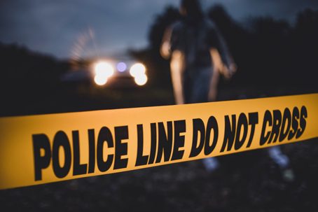 Police units react on the spot. A horrible crime near the river. Police line Do not cross